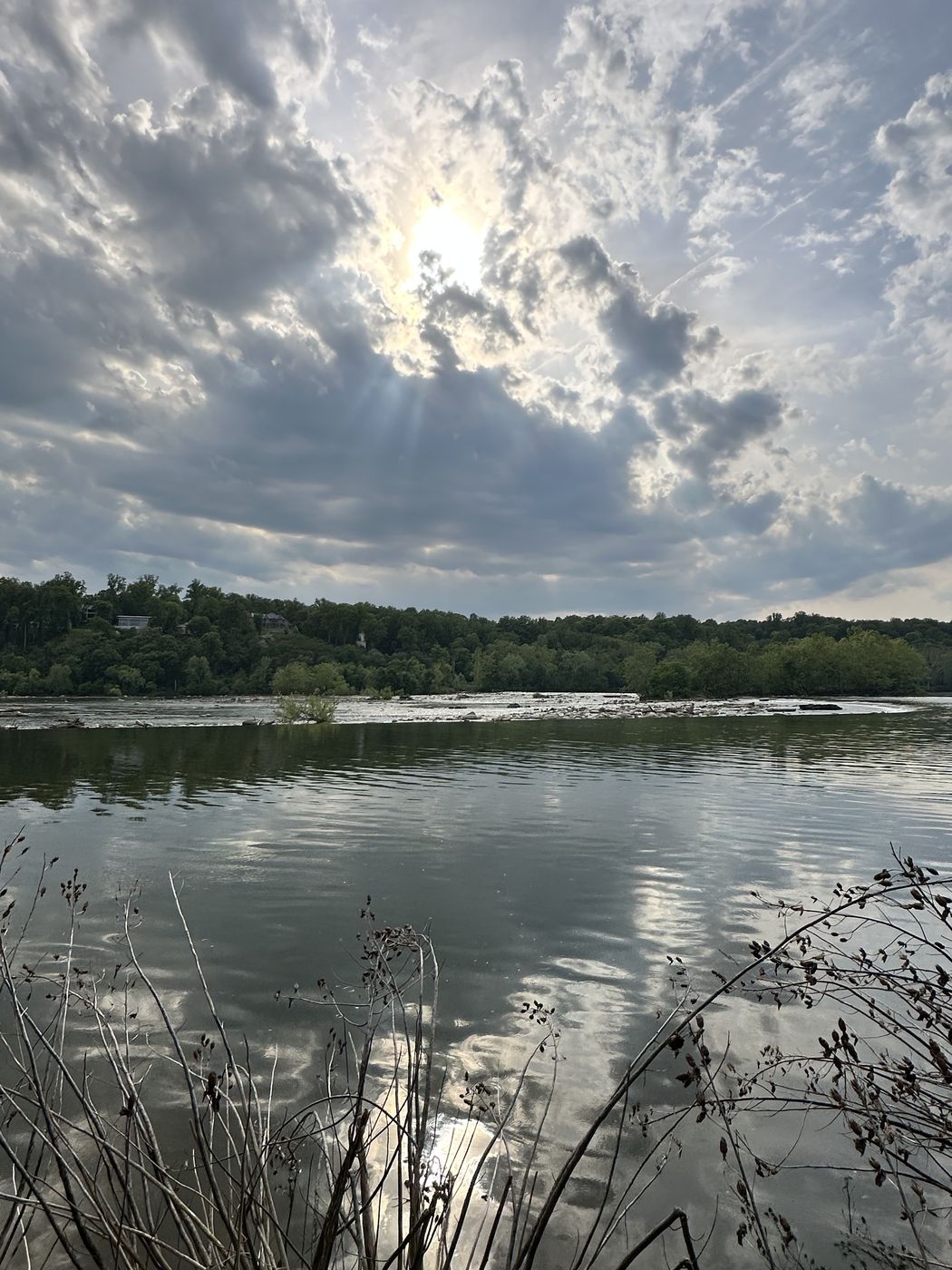 Clouds mirrored in the wide, calm Potomac river